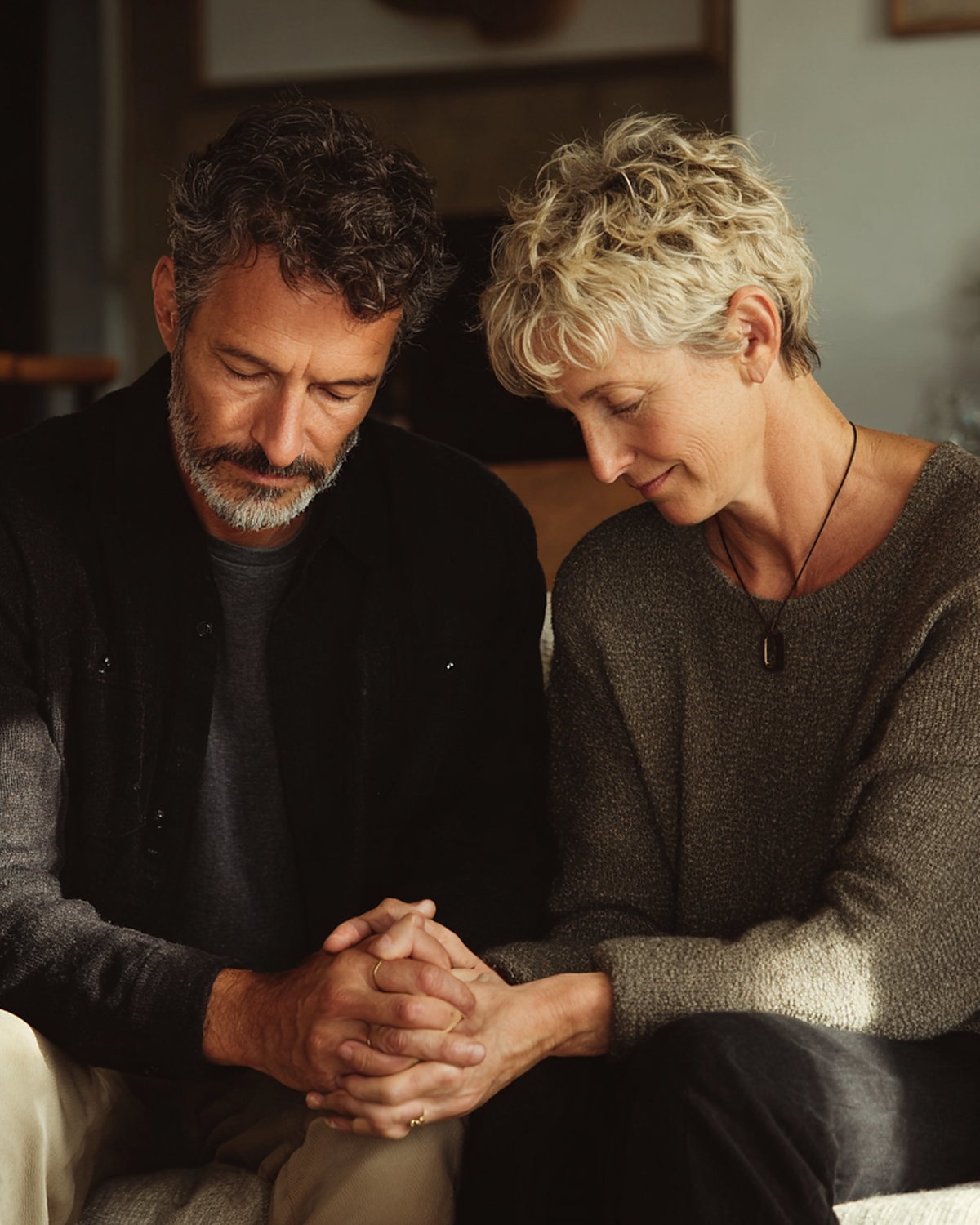 A pastoral conversation between two people seated together